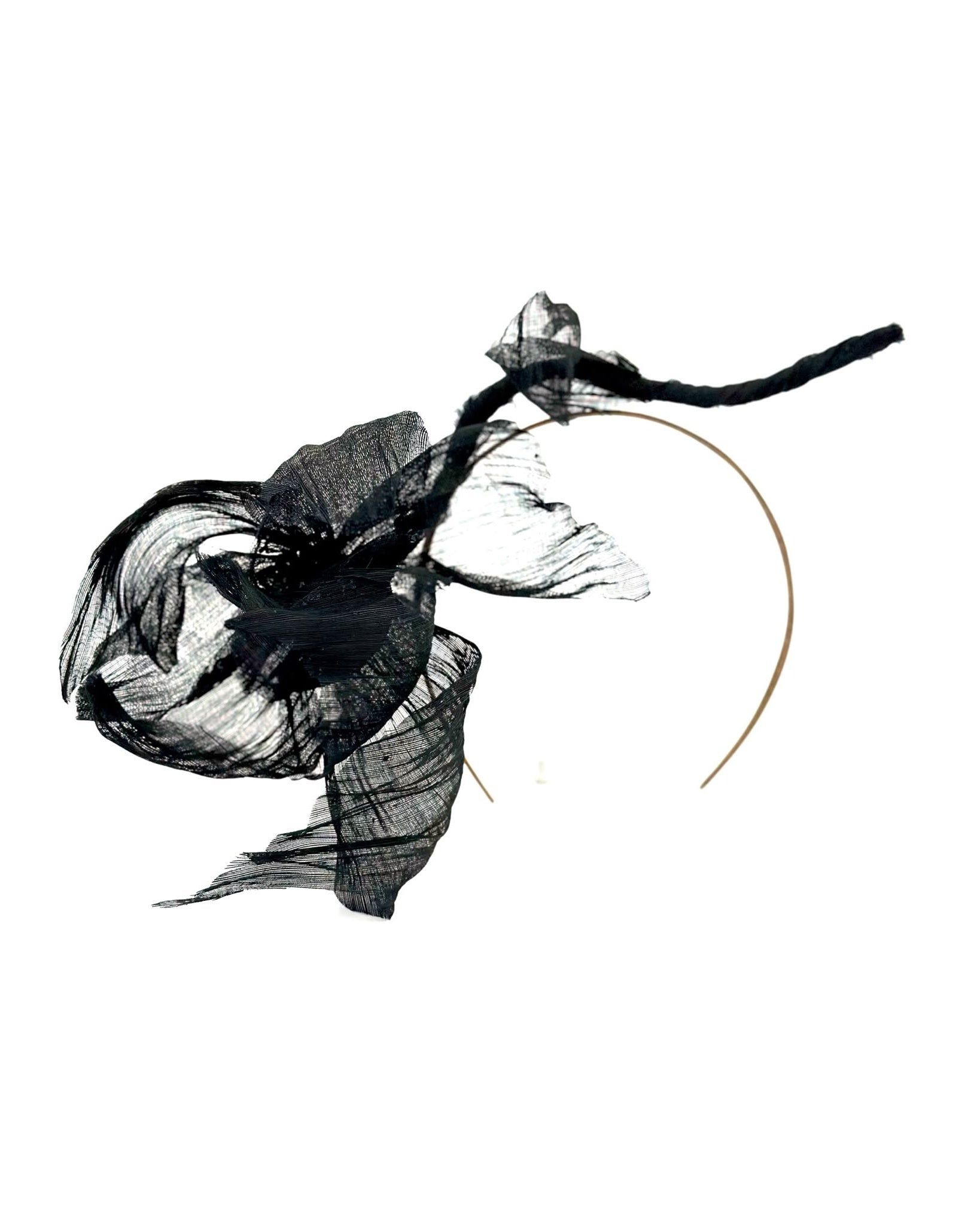 Black abaca flower headpiece with sheer petals and a trailing stem on a fine gold headband, Maria Monica London