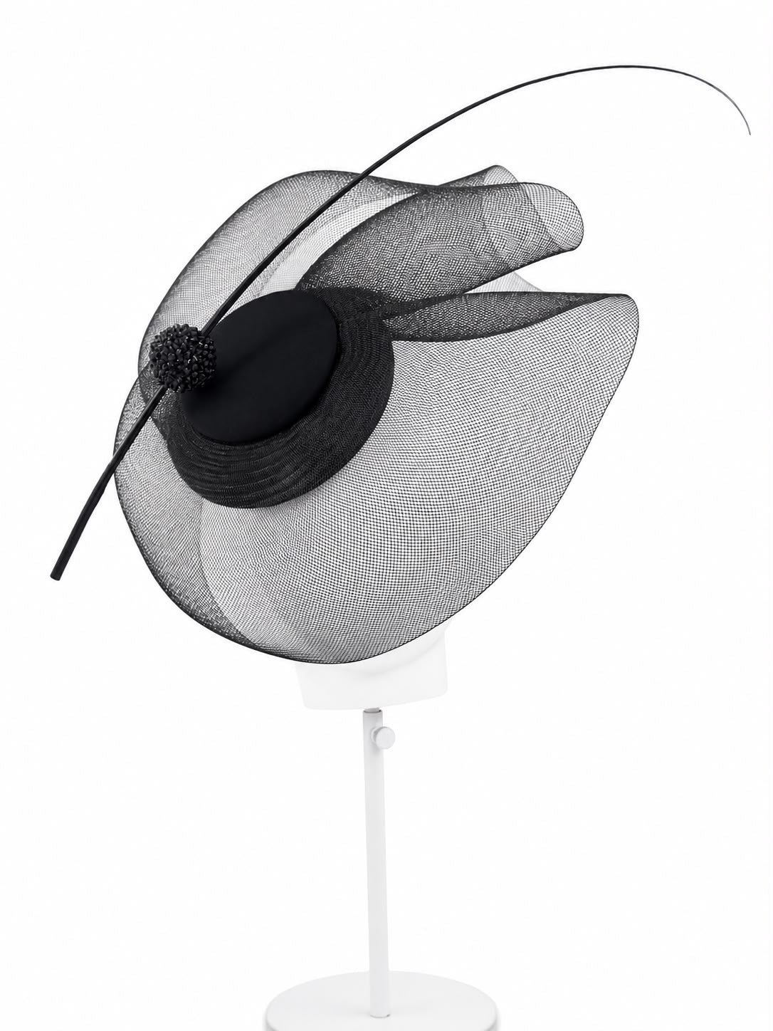 Black crinoline cocktail hat seen from above, showing the sculpted layers of sheer crinoline and the sweeping quill, Maria Monica London