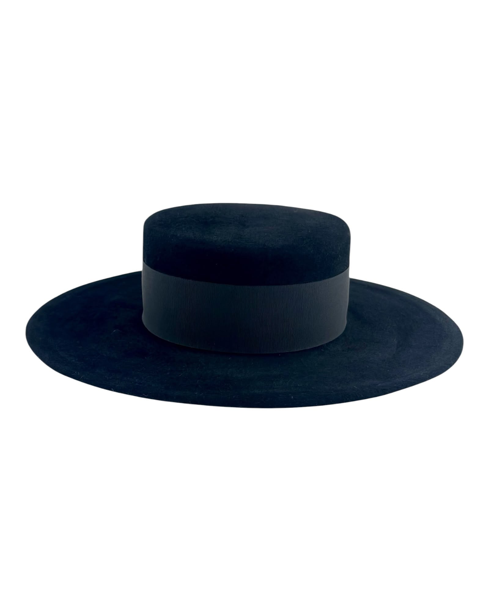 Side view of the black velvet felt boater showing the flat crown top and the clean brim line, couture millinery handmade in London