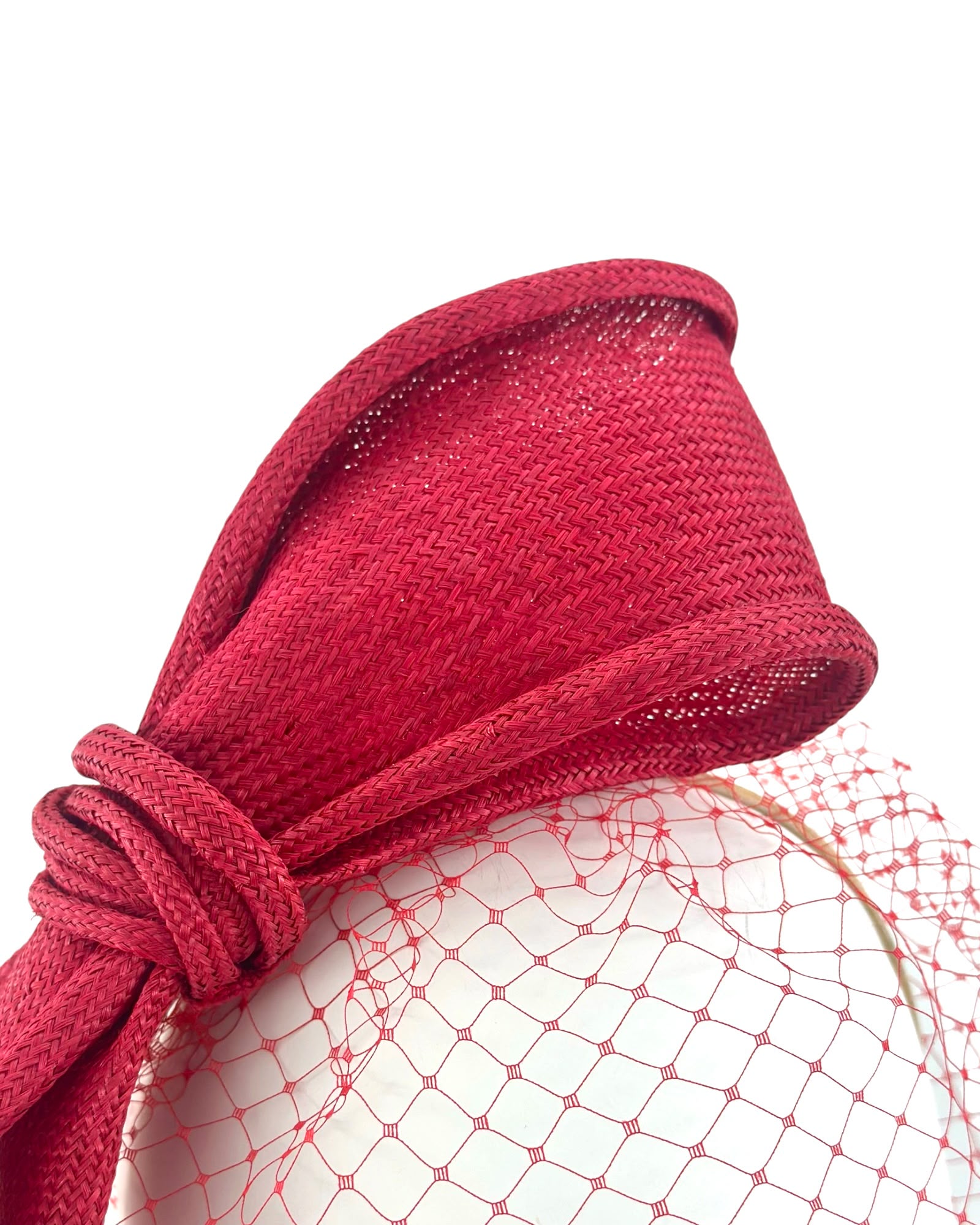 Close view of the fine crimson parasisal straw weave and the hand-shaped knot of the bow, Maria Monica London