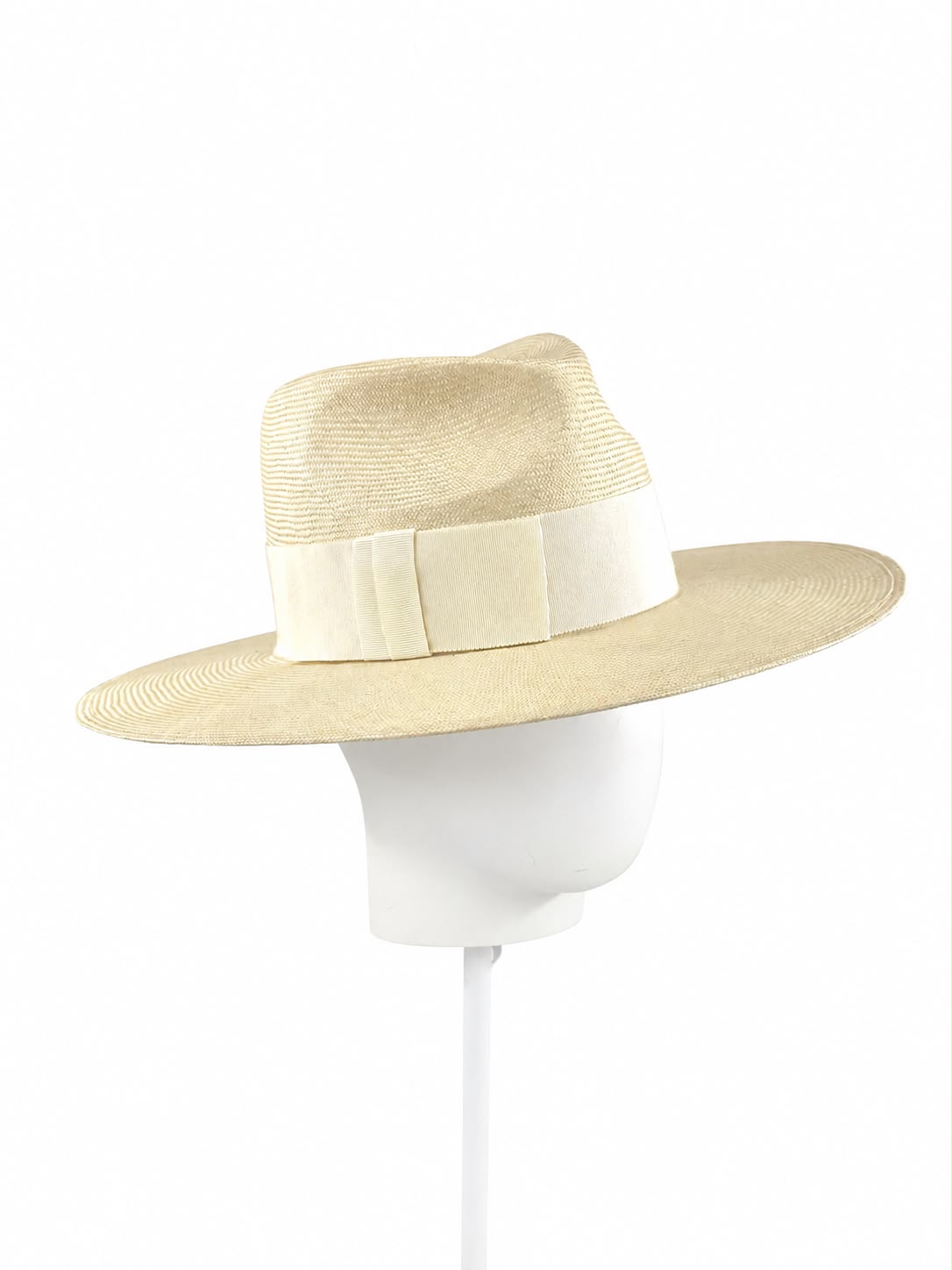 Cream parasisal straw fedora shown on the block, angled, Maria Monica London