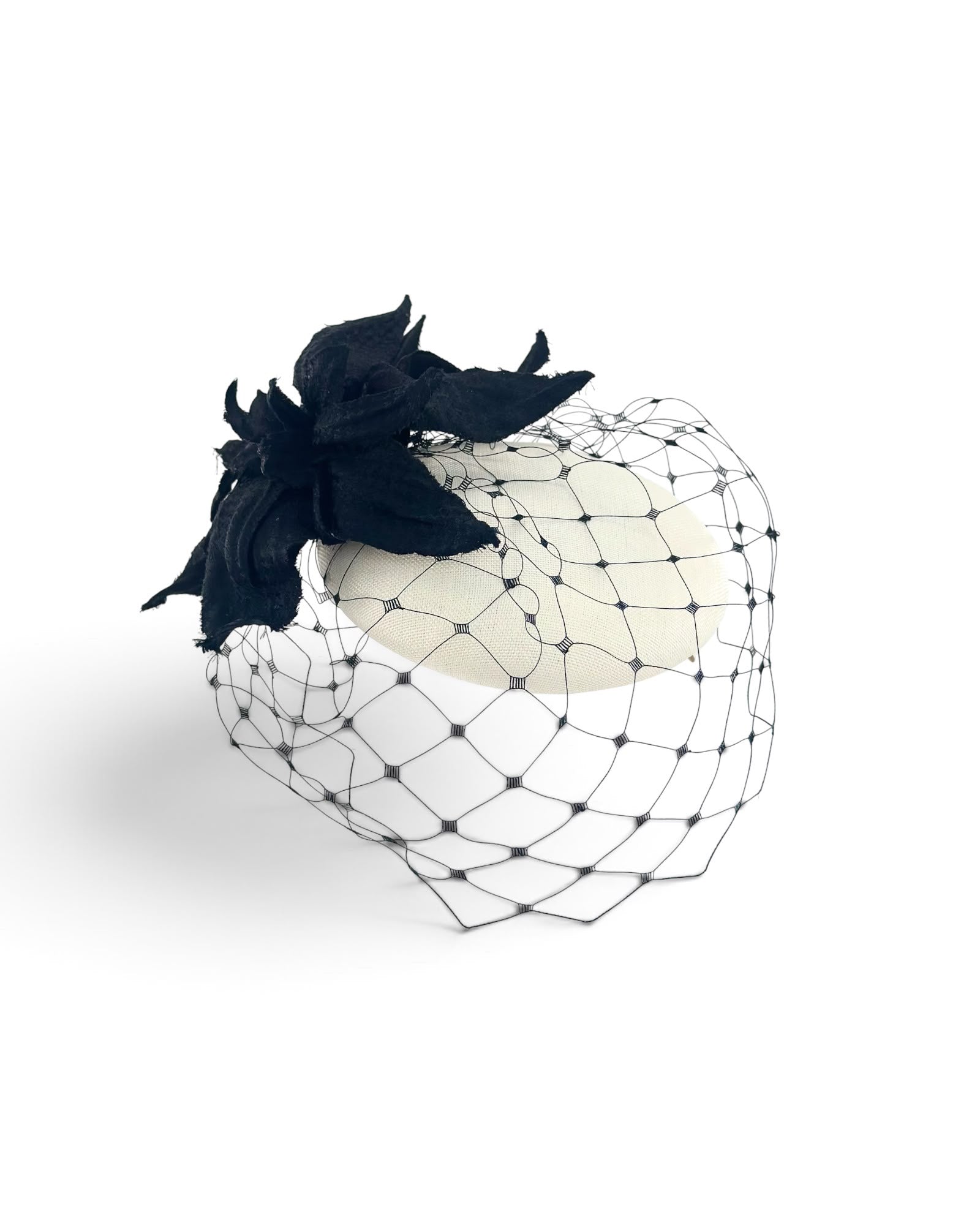 Ivory cocktail hat with a black fabric flower and a black diamond net veil, Maria Monica London
