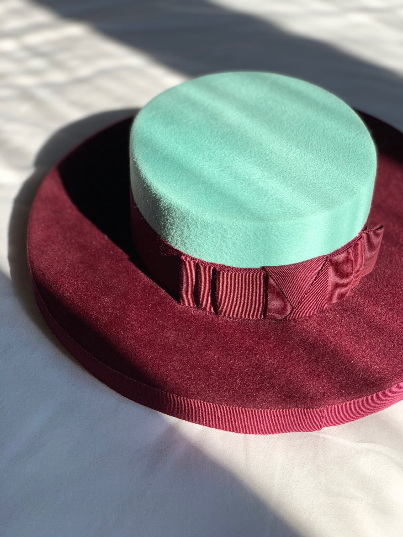 Two-tone wool felt boater with a mint crown and burgundy brim, Maria Monica London
