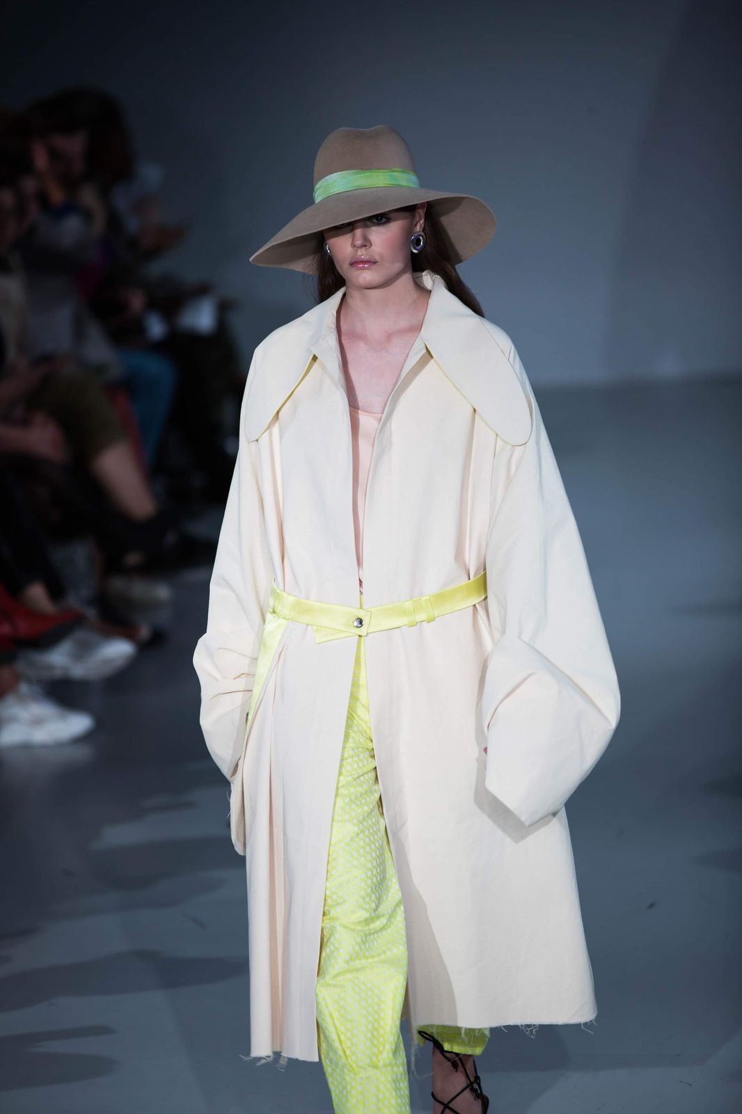 Model wearing a bespoke handcrafted hat by couture milliner Maria Monica London