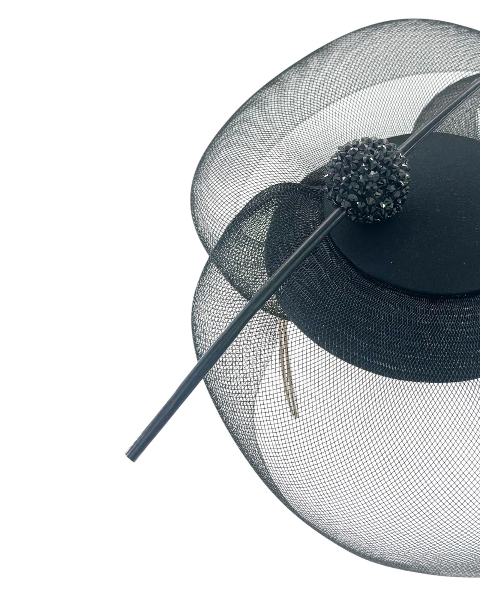 Close view of the Swarovski crystal sphere and the feather quill on the black crinoline cocktail hat, Maria Monica London