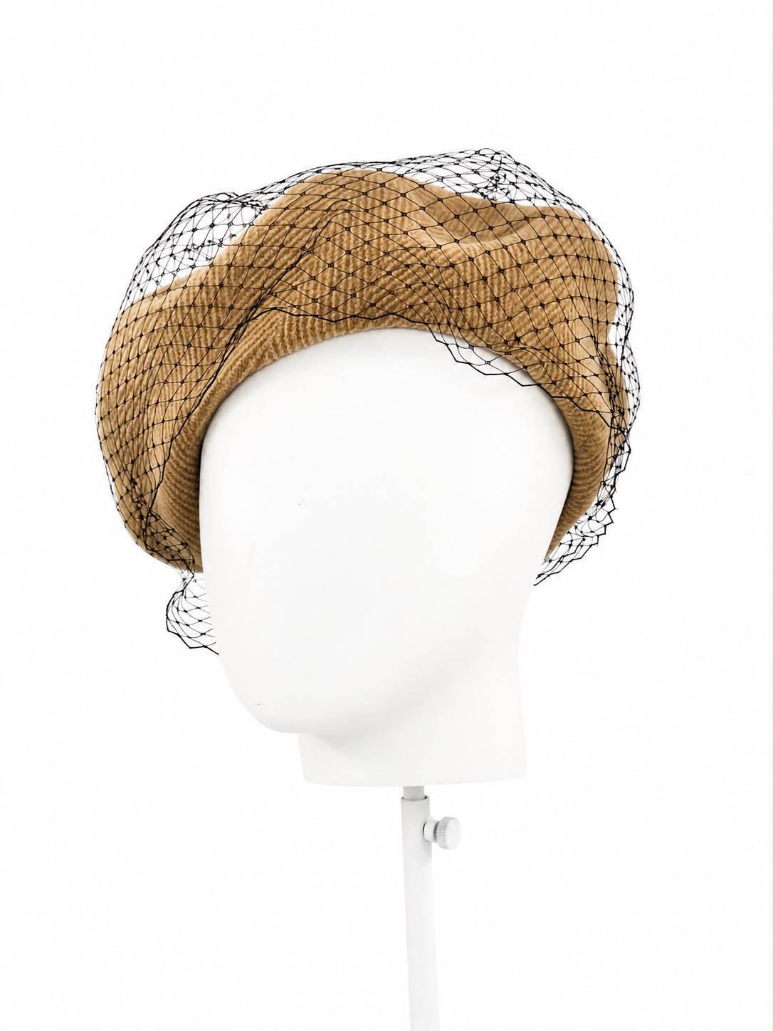 Caramel ribbed weave beret with a black birdcage veil, shown on a display head, Maria Monica London