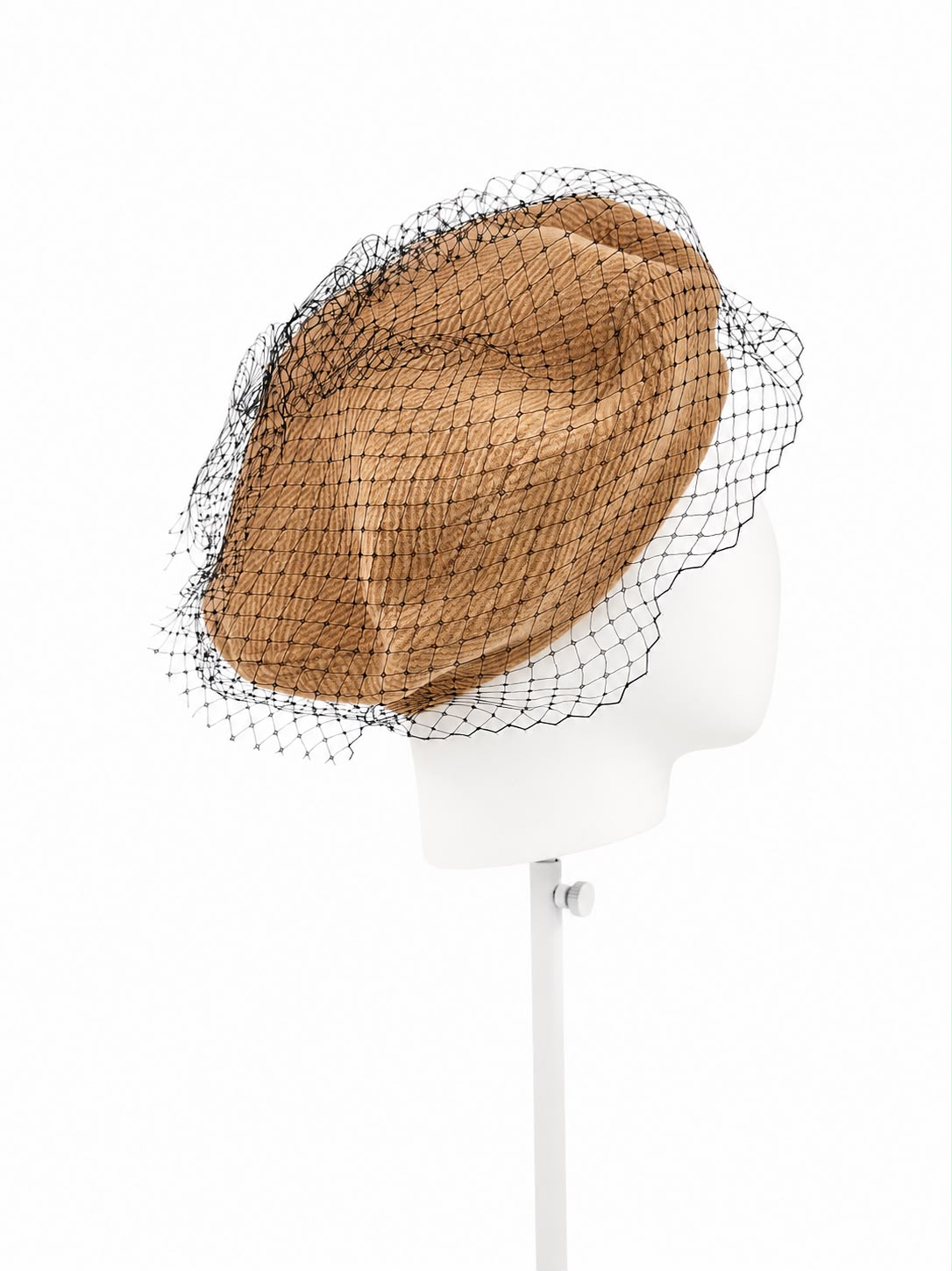 Caramel beret with black birdcage veiling over the crown, shown angled on a white display head, Maria Monica London
