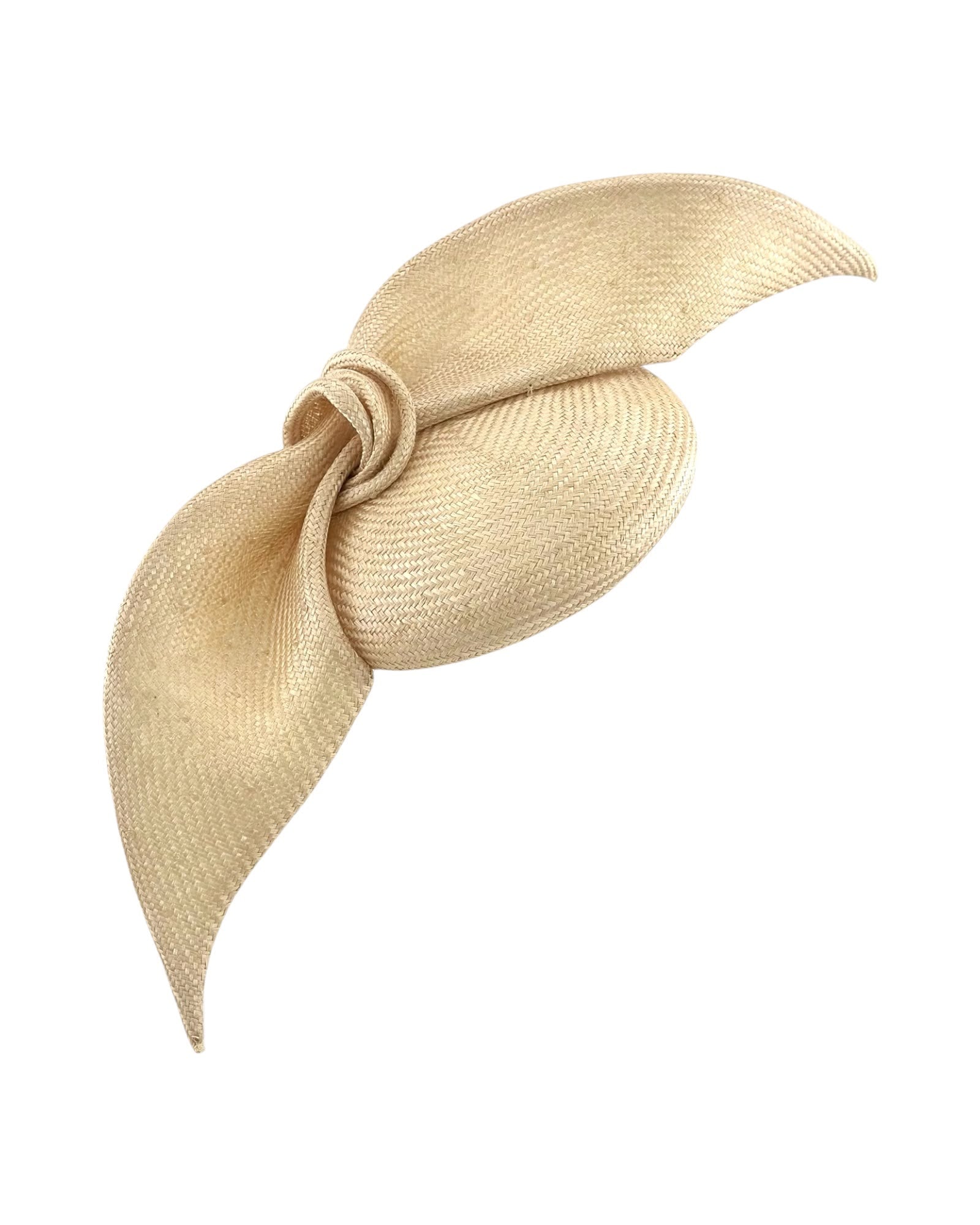 Champagne parasisal straw cocktail hat with a large knotted sculptural bow, shown off the head, Maria Monica London