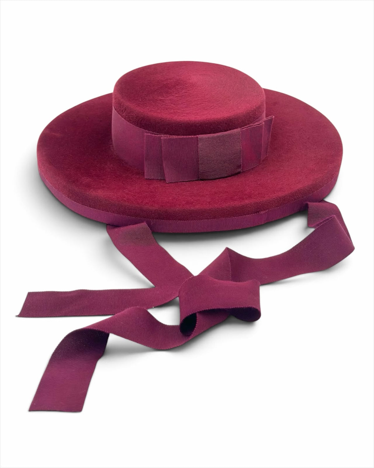 Claret oversized felt boater with a grosgrain crown band, bow and long ribbon ties, Maria Monica London