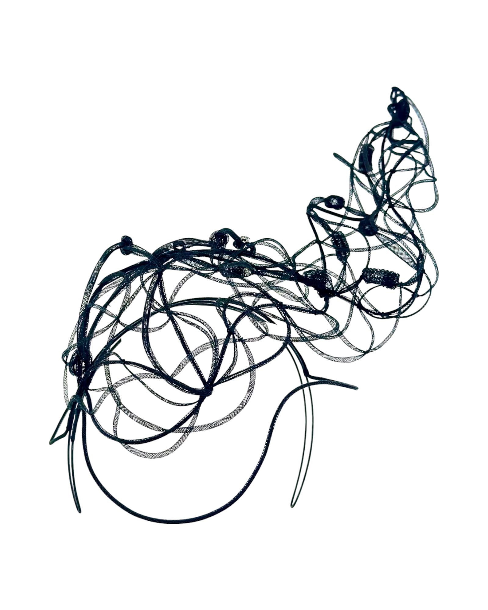 Black crinoline headpiece seen from above, showing the looping architectural form and hand bound accents, Maria Monica London