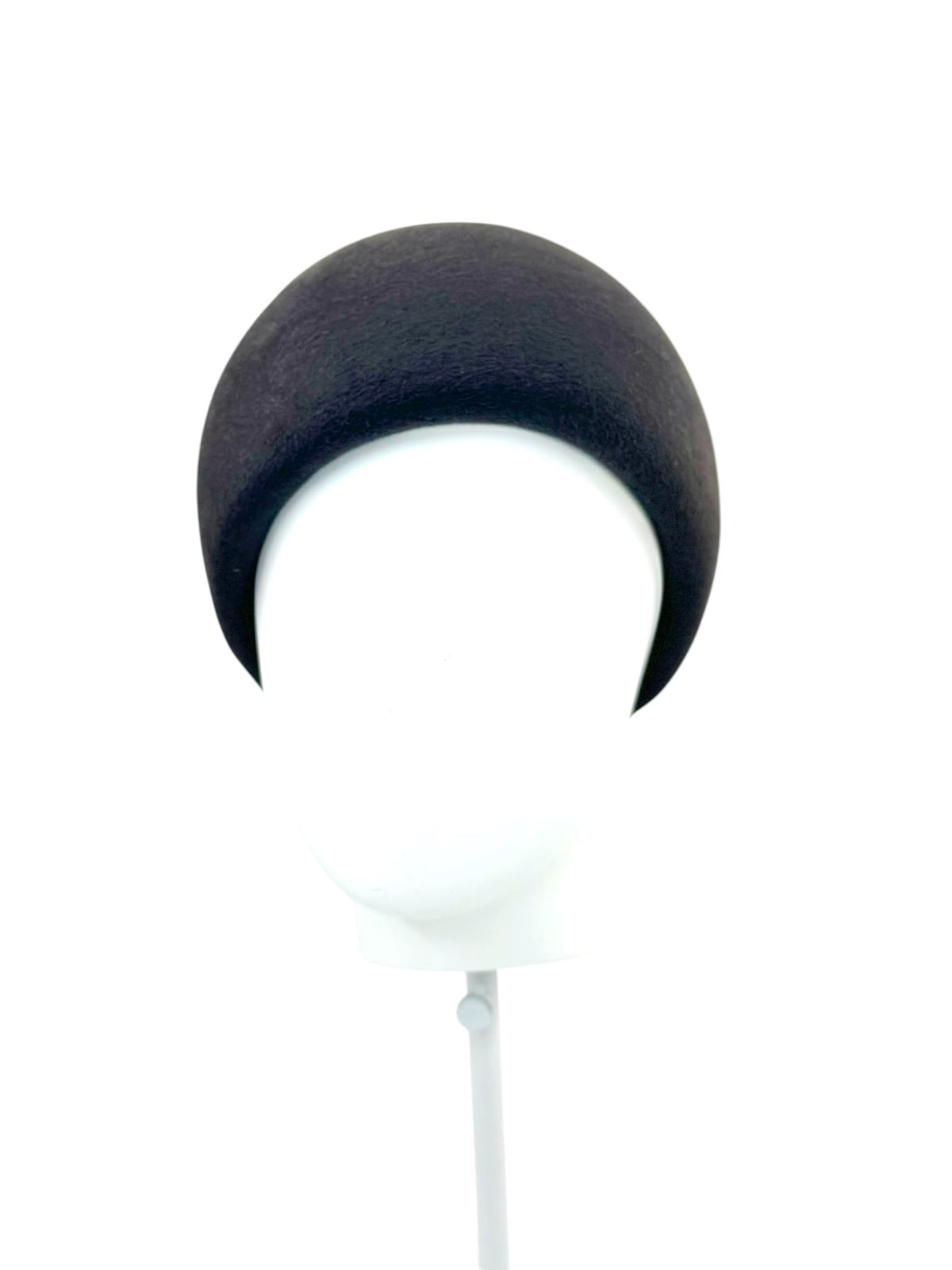 Deep pillbox hat in dark charcoal felt, front view on a white display head, Maria Monica London