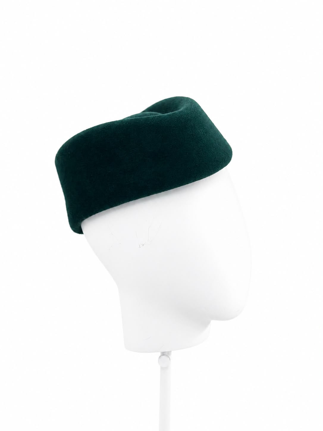 Deep teal sculptural pillbox hat, angle view, Maria Monica London