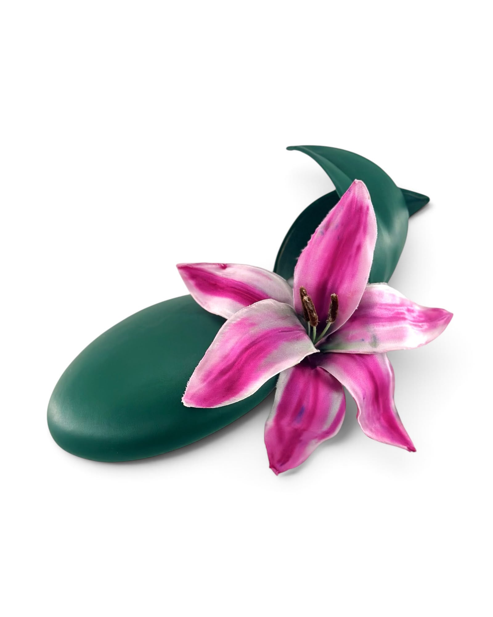 Emerald green leather cocktail hat with a hand-painted pink lily and a leaf, shown off the head, Maria Monica London