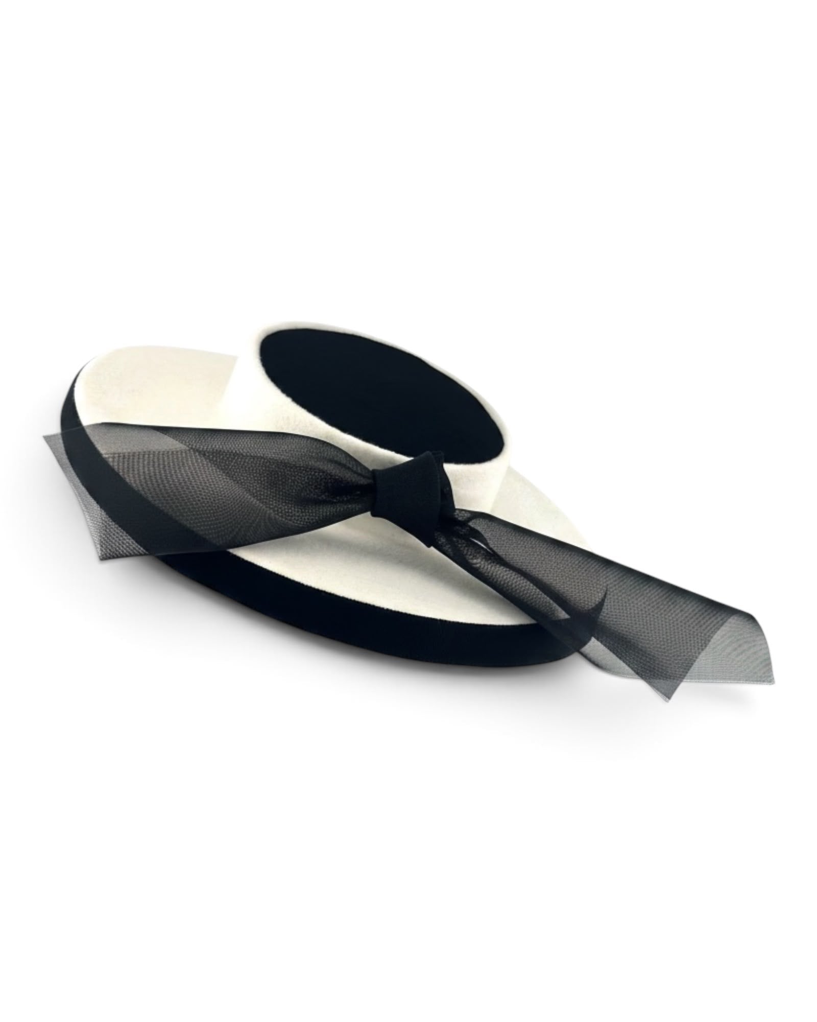Ivory felt boater seen from above, showing the black wool crêpe crown and the trailing black crinoline bow, Maria Monica London