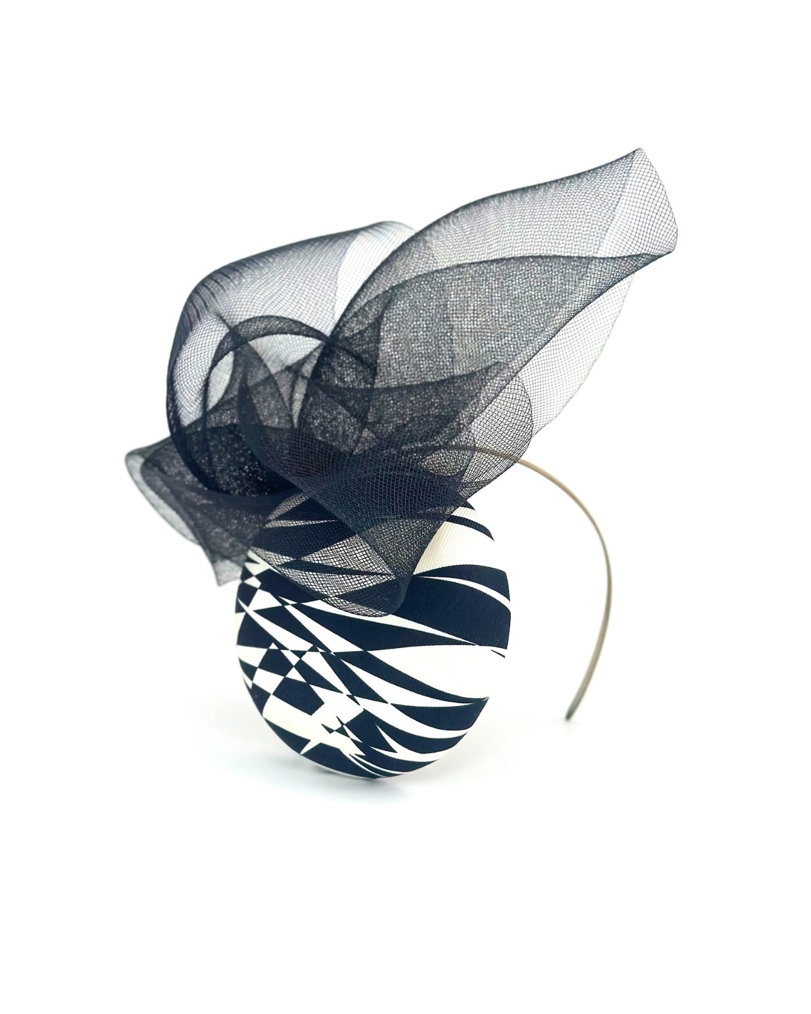 Printed black and white silk cocktail hat with a sweeping black crinoline flourish, Maria Monica London