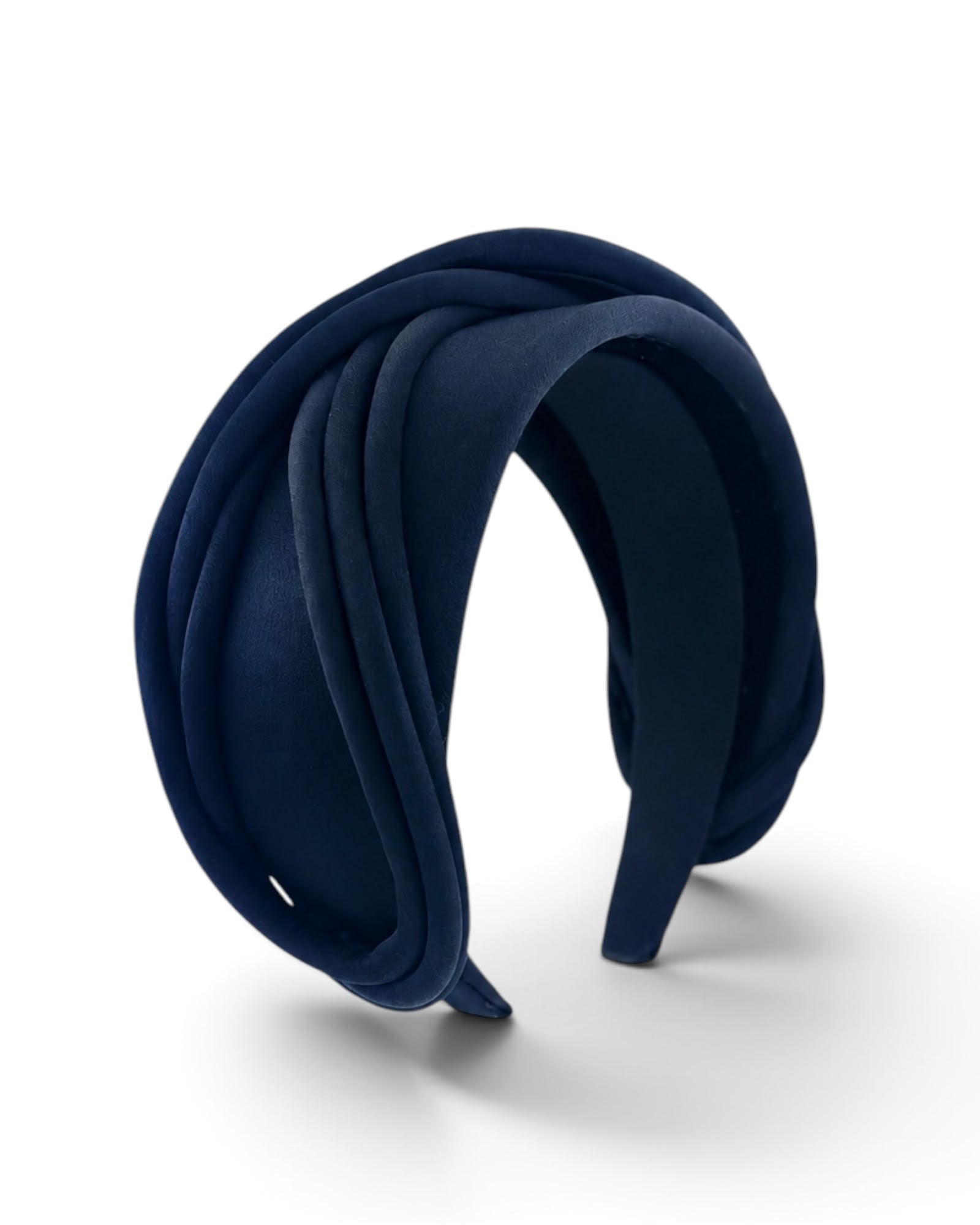 Navy satin headband with layered loops of piping, three quarter view on white, Maria Monica London
