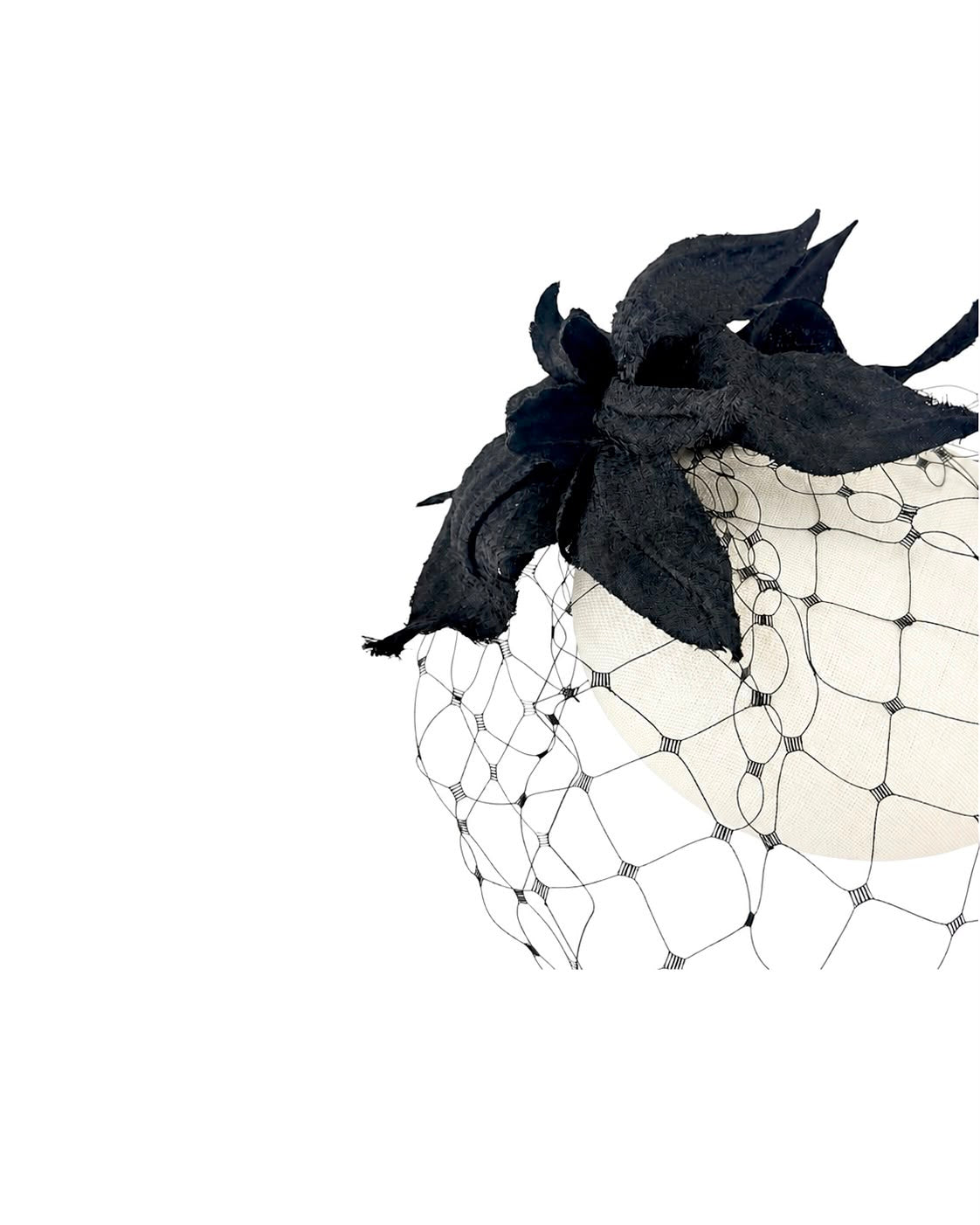 Black open weave veil across an off-white straw crown beside a black silk flower, Maria Monica London