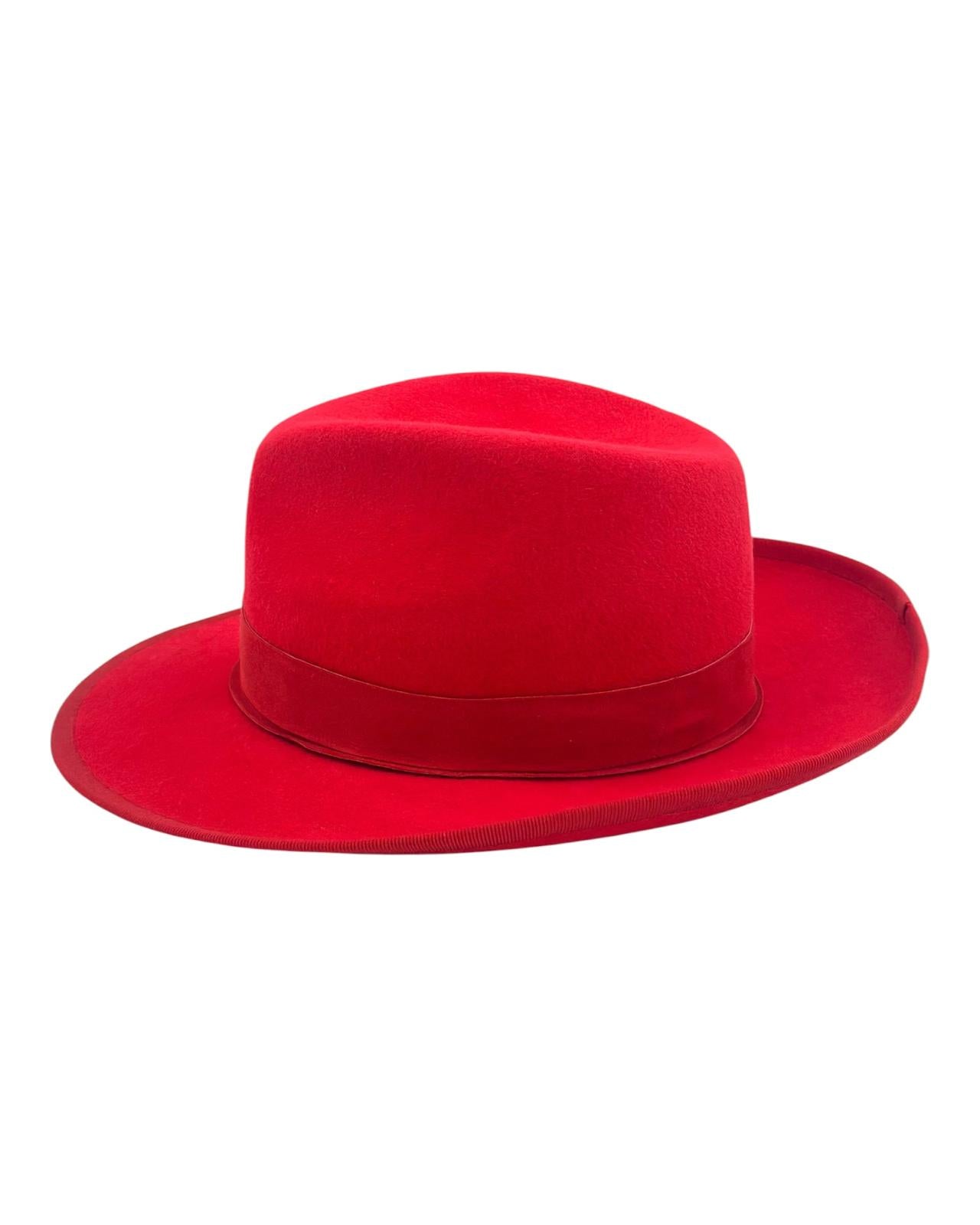 Side view of the scarlet red felt trilby showing the brim line, handmade in the London atelier