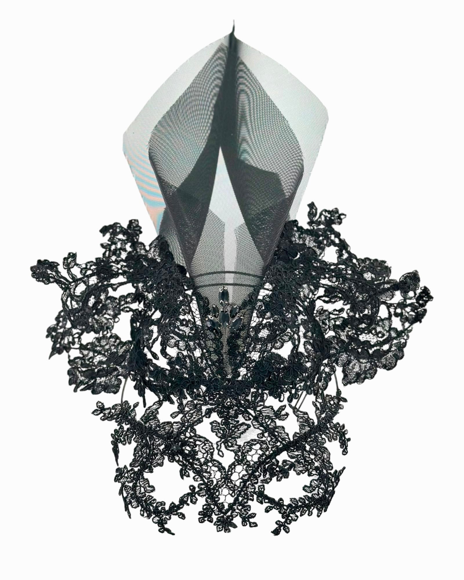 Black lace motifs arranged around a sheer crinoline spire, front view of the lace mask headpiece, Maria Monica London